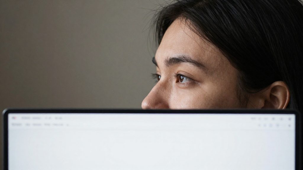 What monitor height helps prevent neck pain?